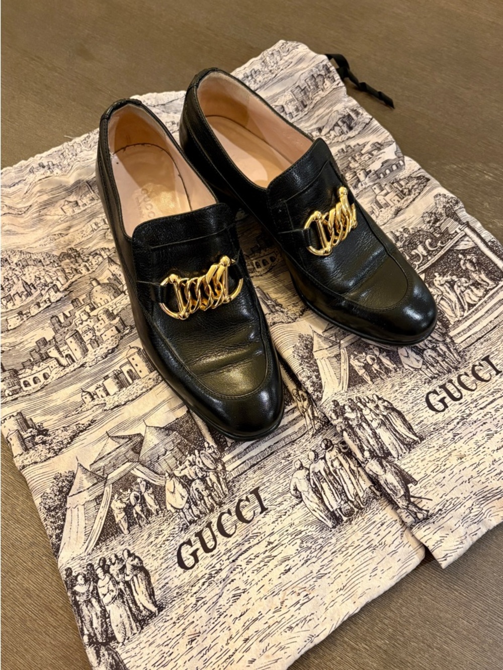 Gucci Black Leather Loafers with Gold Chain Accent | Ice Lolly